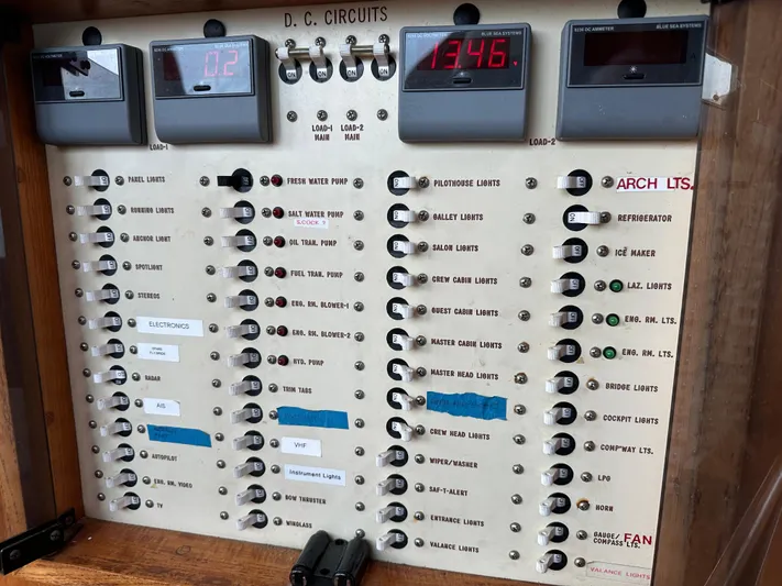 Gitana Yacht Photos Pics Electrical panel on a 1986 Wilbur Hunt Yachts boat, showing DC circuits and digital displays.