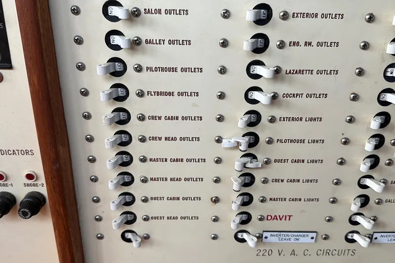 Gitana Yacht Photos Pics Electrical panel on 1986 Wilbur Hunt Yachts, showing various circuit switches and labels.