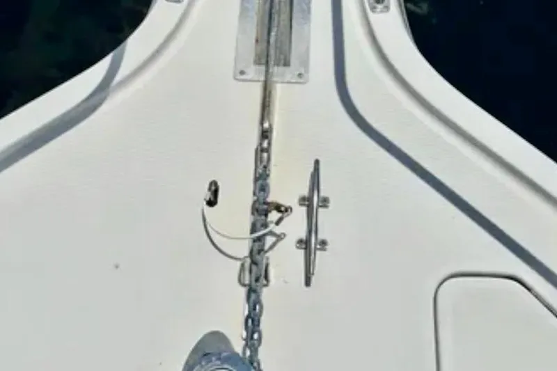  Yacht Photos Pics Bow of a 2000 Tiara 37 Open boat with anchor chain and cleat.