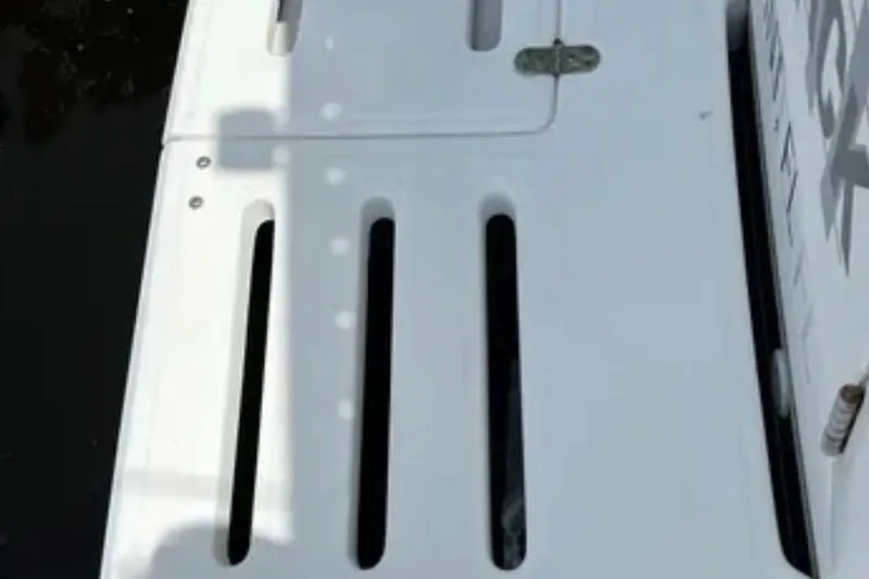  Yacht Photos Pics White deck of 2000 Tiara 37 Open boat with slotted design.