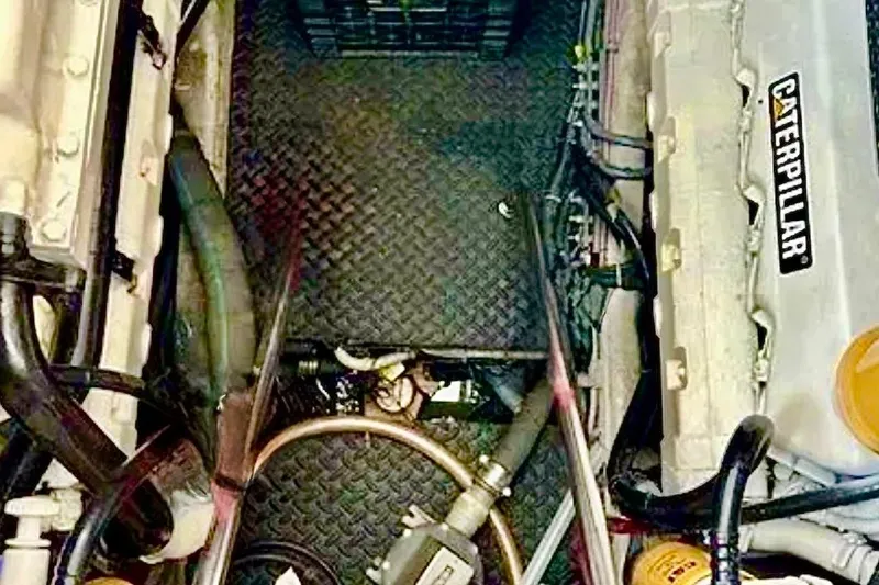  Yacht Photos Pics Engine room of a 2000 Tiara 37 Open boat with Caterpillar engine components.