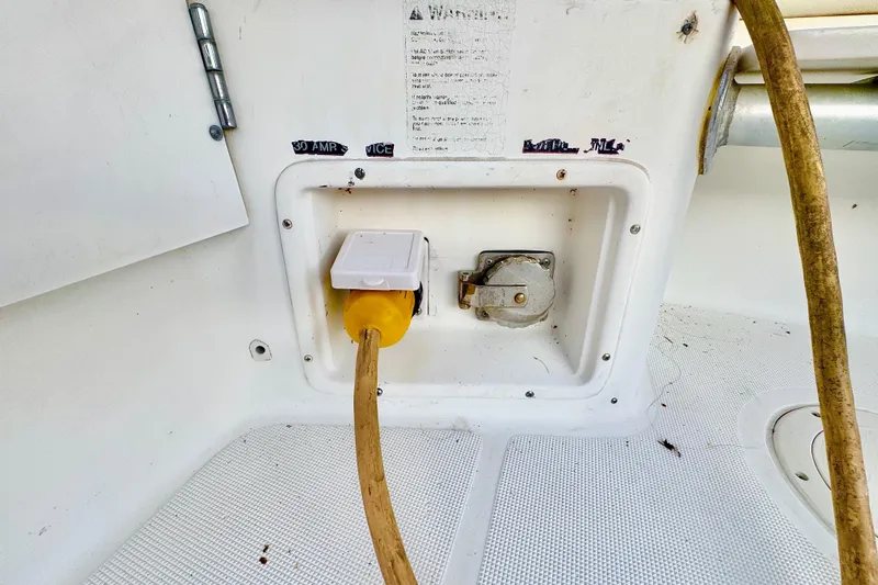  Yacht Photos Pics Electrical outlet on 2000 Tiara 37 Open boat with yellow power cord connected.