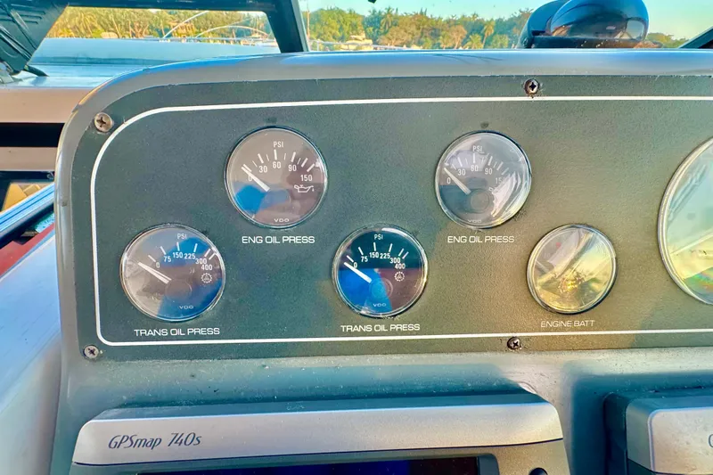  Yacht Photos Pics Dashboard gauges of a 2000 Tiara 37 Open boat, showing oil pressure and battery levels.