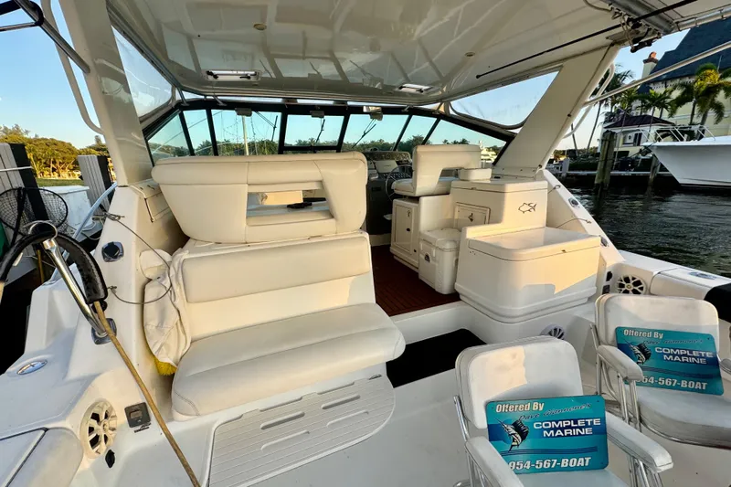  Yacht Photos Pics Interior view of 2000 Tiara 37 Open yacht with white seating and helm station.