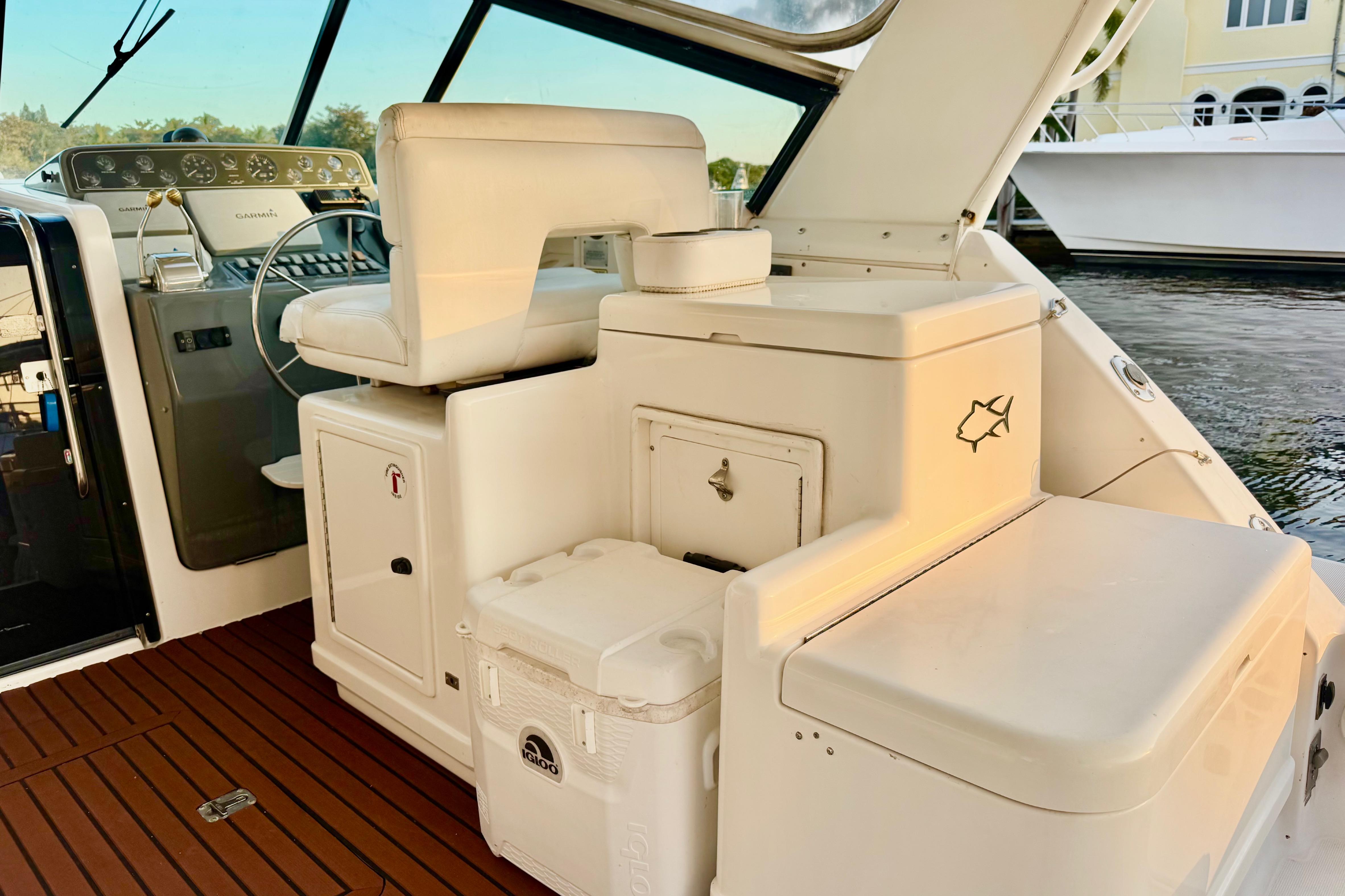Interior of a 2000 Tiara 37 Open yacht with helm and seating area.