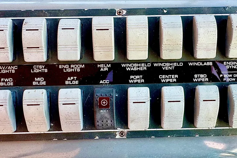  Yacht Photos Pics Control panel switches on a 2000 Tiara 37 Open boat dashboard.