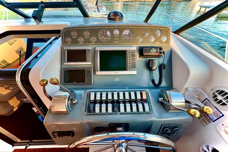  Yacht Photos Pics Control panel of a 2000 Tiara 37 Open boat with navigation instruments.