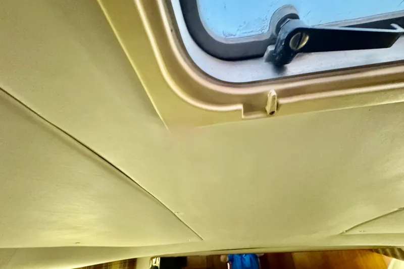  Yacht Photos Pics Interior ceiling view of a 2000 Tiara 37 Open boat with a hatch window.