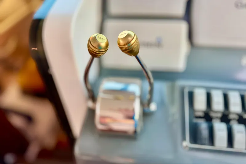  Yacht Photos Pics Close-up of Tiara 37 Open 2000 boat controls with gold levers.