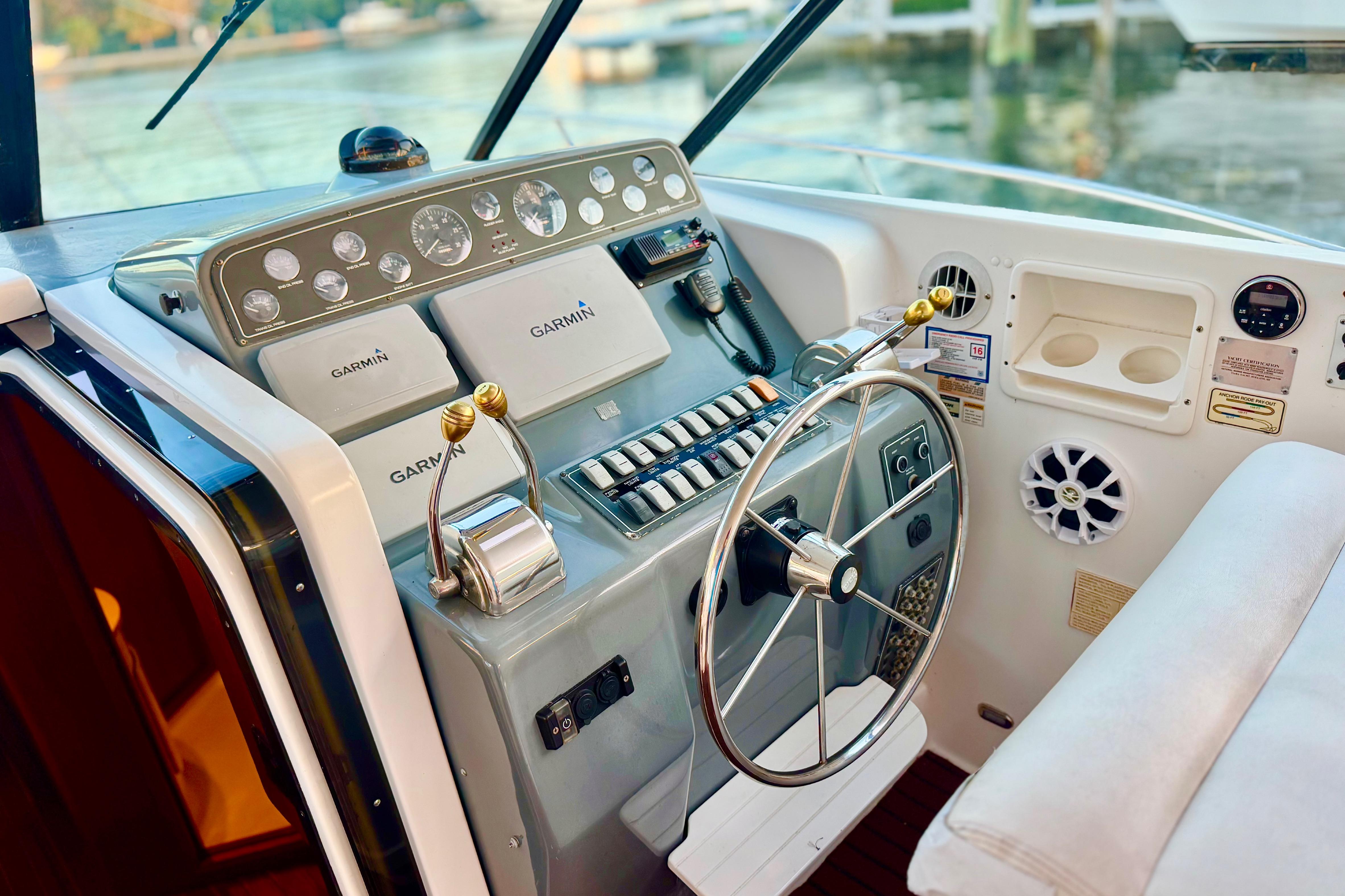 Control panel of a 2000 Tiara 37 Open boat with Garmin navigation systems.