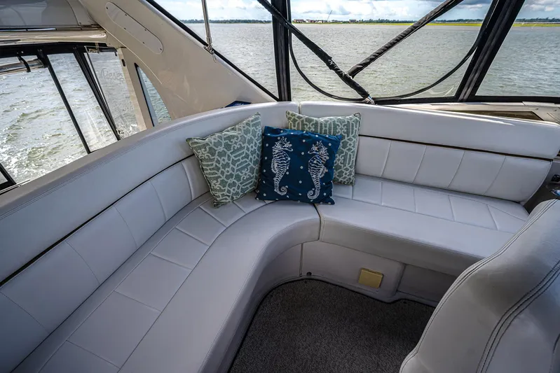 Fiesta Bayb Yacht Photos Pics Luxurious seating area on 2003 Carver 444 Cockpit Motor Yacht with decorative pillows.