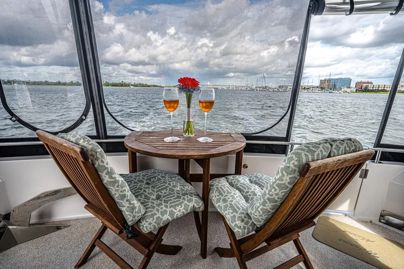 Fiesta Bayb Yacht Photos Pics Cozy seating on 2003 Carver 444 Cockpit Motor Yacht with waterfront view.