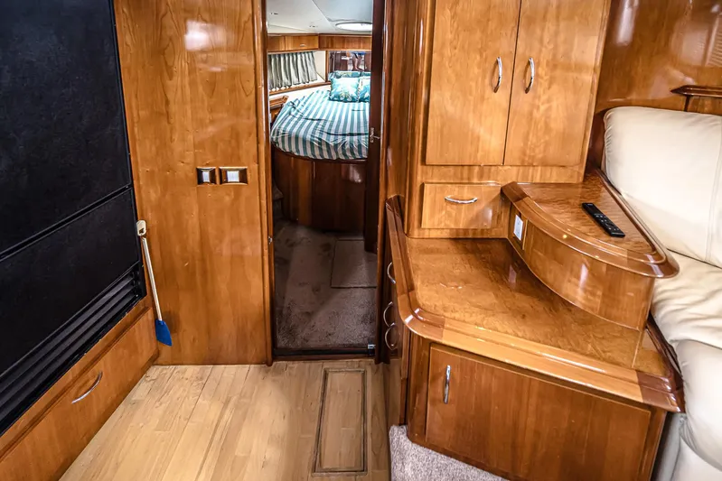 Fiesta Bayb Yacht Photos Pics Interior of 2003 Carver 444 Cockpit Motor Yacht with wood cabinetry and cozy bedroom.