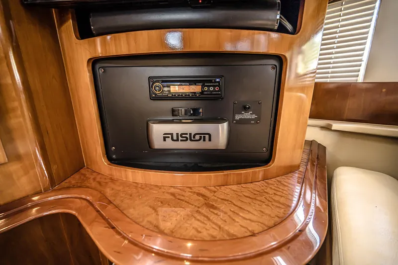 Fiesta Bayb Yacht Photos Pics 2003 Carver 444 Cockpit Motor Yacht interior with Fusion audio system and wood finish.