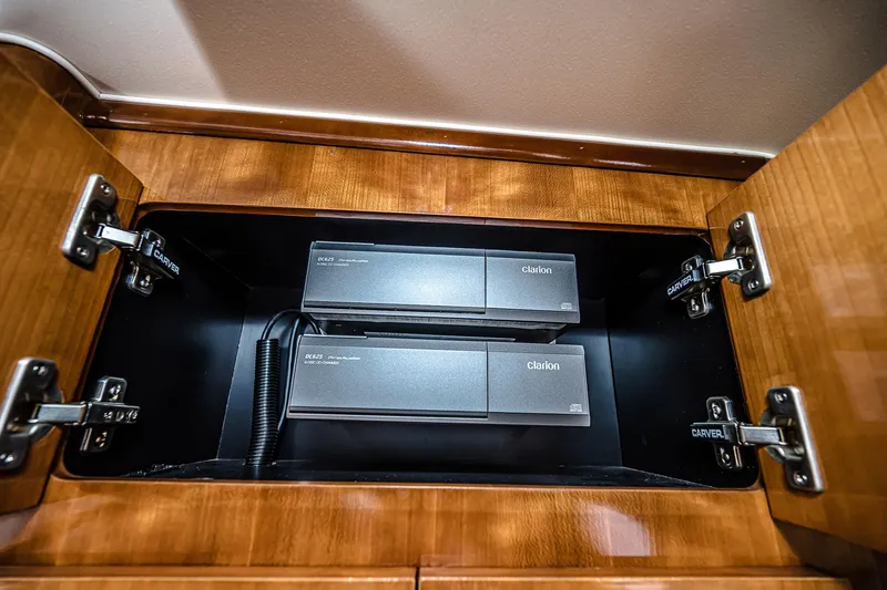 Fiesta Bayb Yacht Photos Pics Carver 444 Cockpit Motor Yacht 2003, Clarion audio system in wooden cabinet.