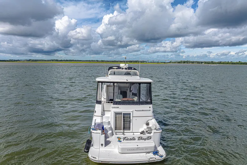 Fiesta Bayb Yacht Photos Pics 2003 Carver 444 Cockpit Motor Yacht on open water under cloudy sky.