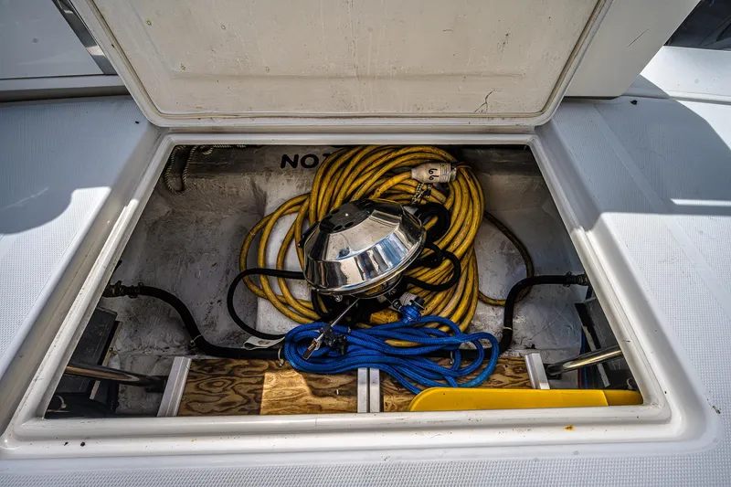 Fiesta Bayb Yacht Photos Pics Storage compartment of 2003 Carver 444 Cockpit Motor Yacht with hoses and equipment.
