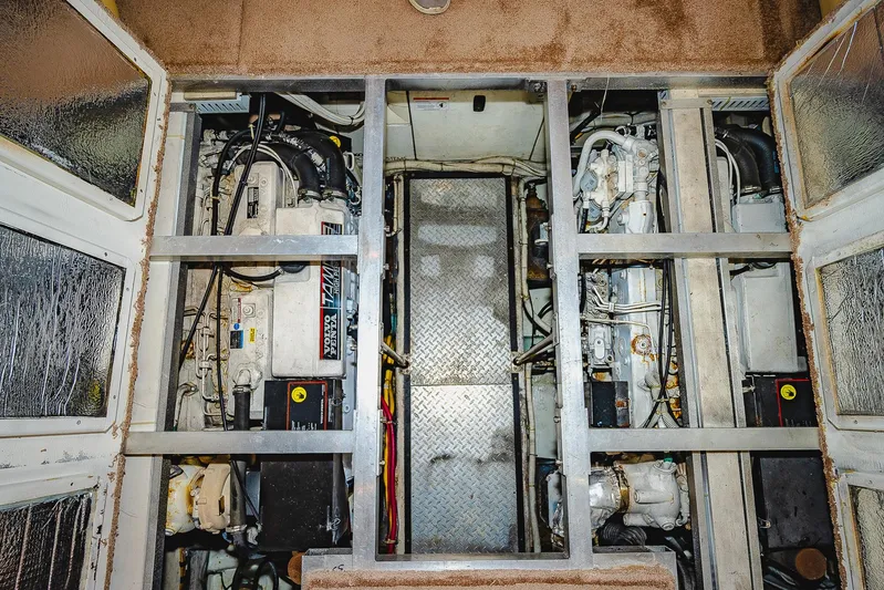 Fiesta Bayb Yacht Photos Pics Engine room of 2003 Carver 444 Cockpit Motor Yacht, showcasing dual engines and mechanical components.