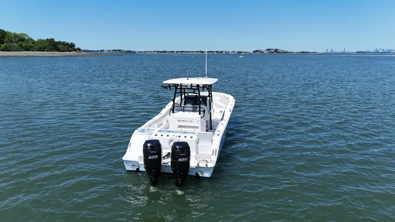 O4 Yacht Photos Pics 2022 Sea Fox 328 Commander boat on open water with twin engines.