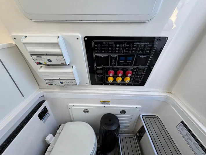O4 Yacht Photos Pics 2022 Sea Fox 328 Commander control panel and marine toilet area.