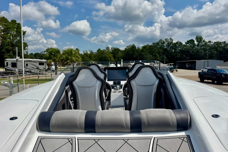  Yacht Photos Pics 2024 Fountain 34 Thundercat boat interior with sleek seating and modern dashboard.