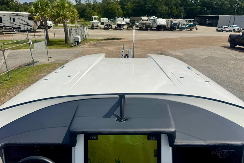  Yacht Photos Pics 2024 Fountain 34 Thundercat boat dashboard with navigation screen, parked in a lot.