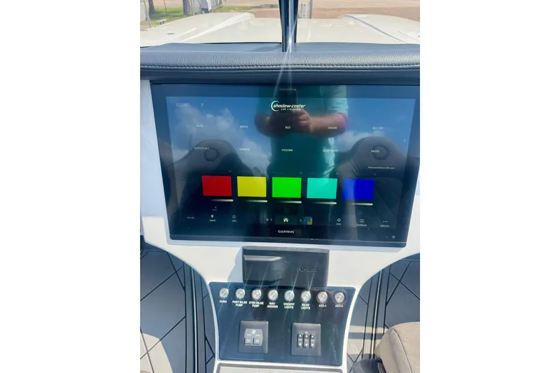  Yacht Photos Pics 2024 Fountain 34 Thundercat dashboard with touchscreen display and control panel.