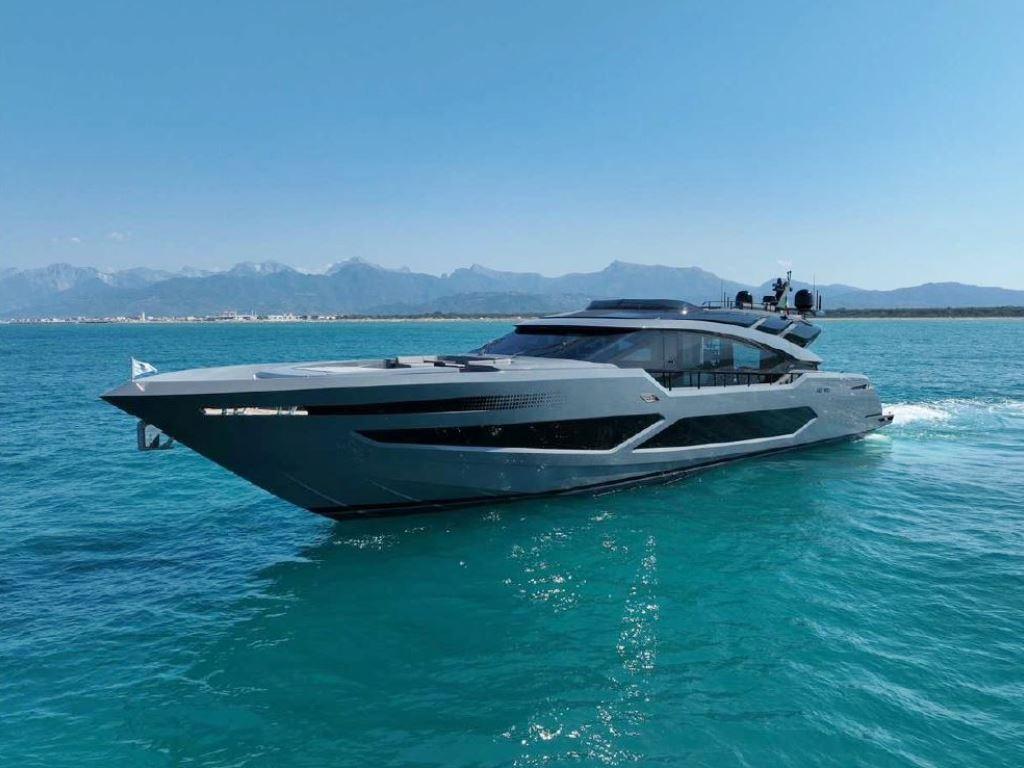 Luxury AB Yachts 100 cruising on clear blue waters, 2022 model.