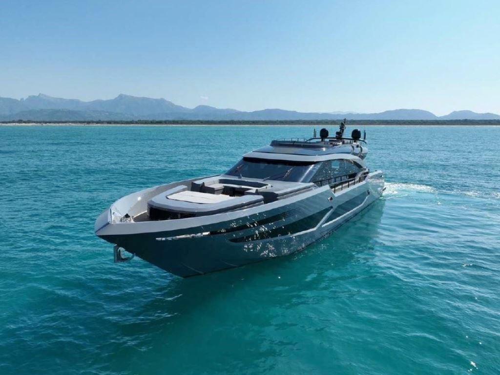 Luxurious 2022 AB Yachts 100 cruising on clear blue waters.