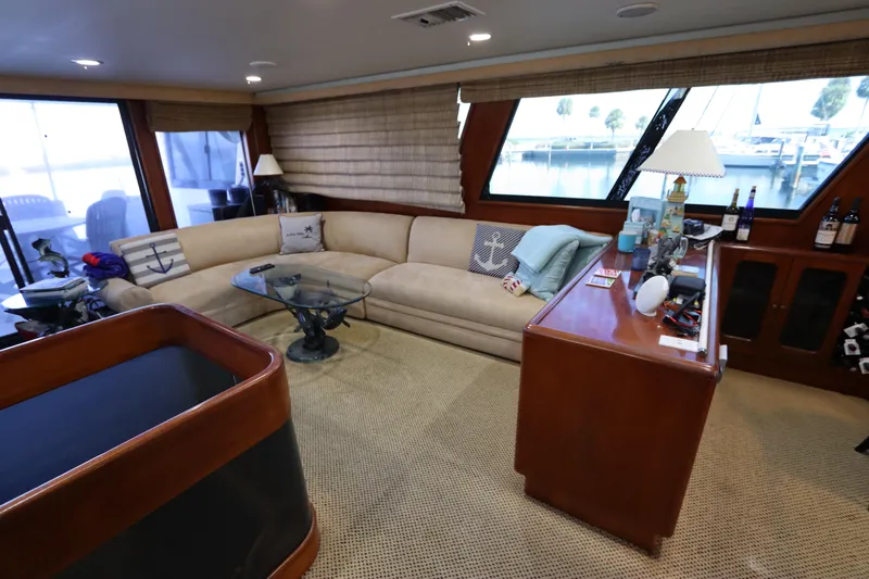  Yacht Photos Pics Luxurious interior of a 1991 Viking Motor Yacht with beige sofa and wooden cabinetry.