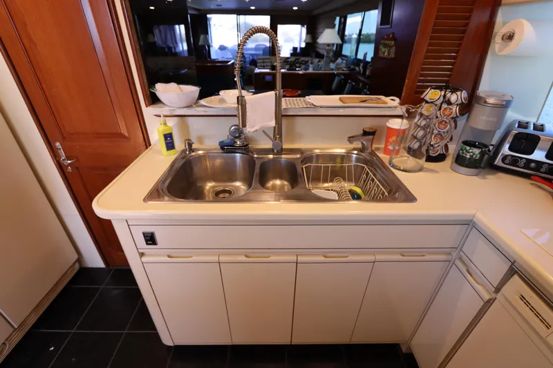  Yacht Photos Pics Kitchen sink area in a 1991 Viking Motor Yacht with modern fixtures and appliances.
