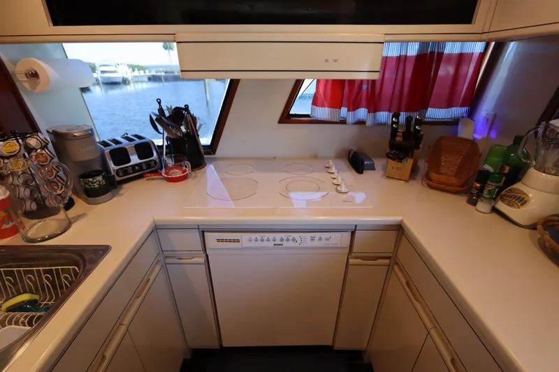  Yacht Photos Pics 1991 Viking Motor Yacht kitchen with modern appliances and waterfront view.