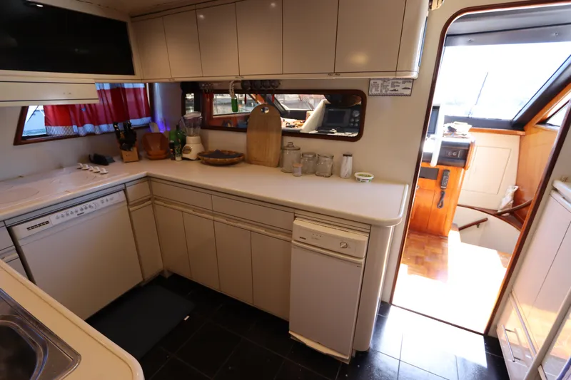  Yacht Photos Pics 1991 Viking Motor Yacht kitchen with modern appliances and ample counter space.