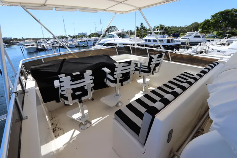  Yacht Photos Pics 1991 Viking Motor Yacht deck with seating and marina view.