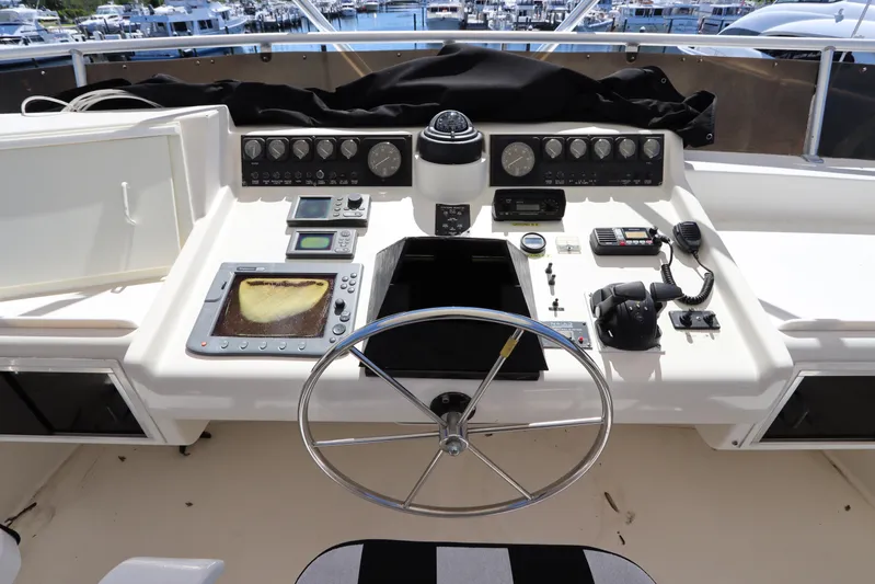  Yacht Photos Pics 1991 Viking Motor Yacht helm with navigation instruments and steering wheel.