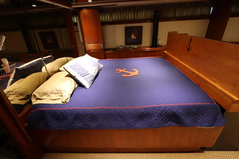  Yacht Photos Pics Luxurious bedroom in a 1991 Viking Motor Yacht with nautical-themed bedding.