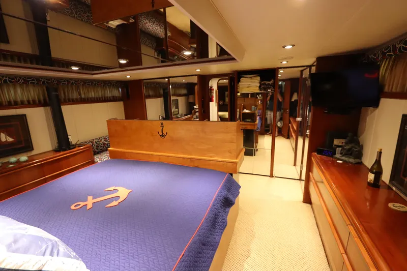  Yacht Photos Pics Luxurious bedroom in a 1991 Viking Motor Yacht with anchor-themed bedding.