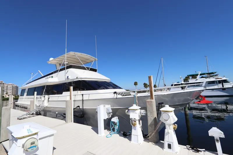  Yacht Photos Pics 1991 Viking Motor Yacht docked at a marina under a clear blue sky.