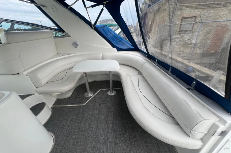 Getaway Yacht Photos Pics 2000 Cruisers Yachts 3870 Express interior with white seating and table.