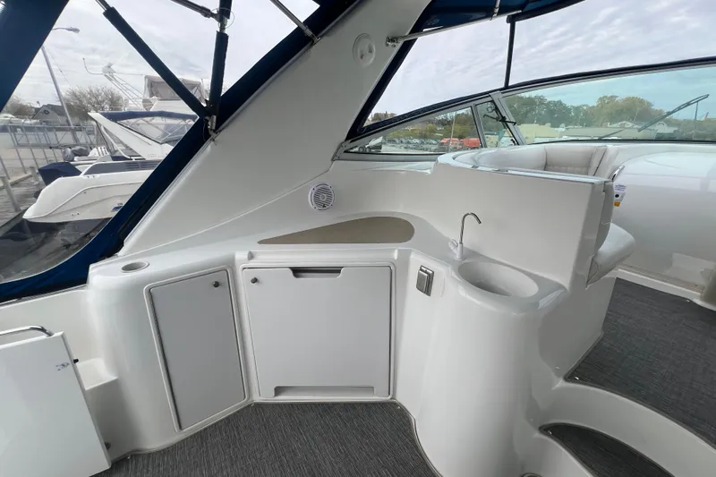 Getaway Yacht Photos Pics 2000 Cruisers Yachts 3870 Express interior with sleek cabinetry and seating area.