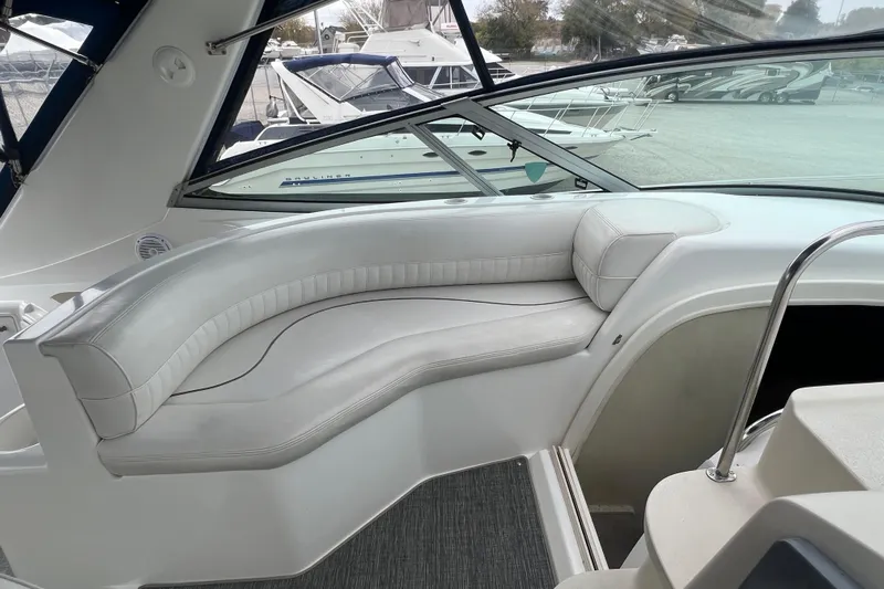 Getaway Yacht Photos Pics 2000 Cruisers Yachts 3870 Express interior with white leather seating and panoramic windows.