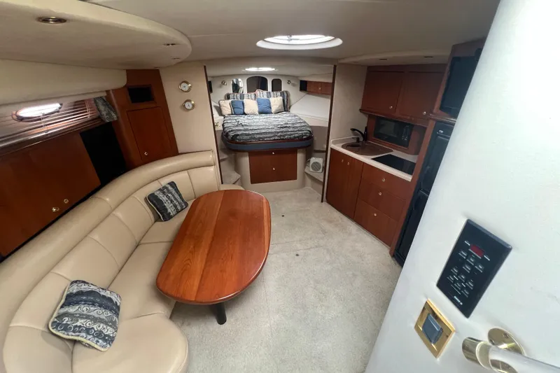 Getaway Yacht Photos Pics Luxurious interior of 2000 Cruisers Yachts 3870 Express with cozy seating and kitchenette.