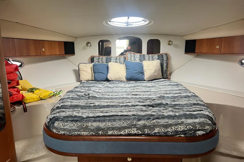 Getaway Yacht Photos Pics Interior of 2000 Cruisers Yachts 3870 Express with cozy bed and storage cabinets.