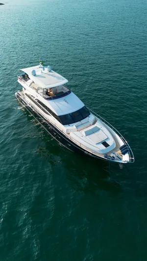 Far Niente Yacht Photos Pics 2014 Princess Flybridge 82 Motor Yacht cruising on open water.