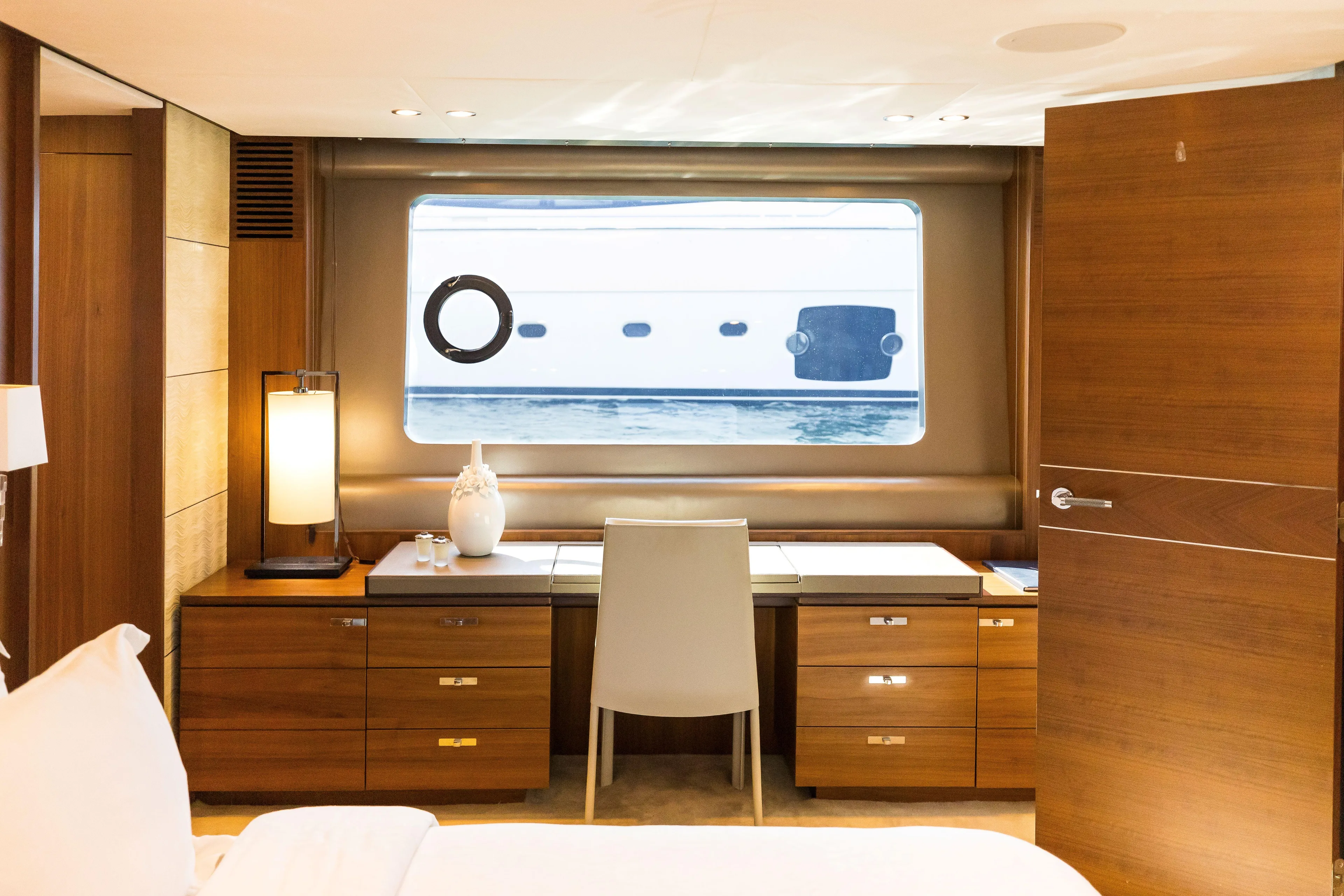 Far Niente Yacht Photos Pics Luxurious cabin interior of 2014 Princess Flybridge 82 Motor Yacht with elegant wood furnishings.