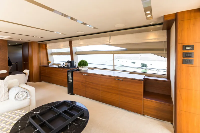 Far Niente Yacht Photos Pics Luxurious interior of 2014 Princess Flybridge 82 Motor Yacht with elegant wood finishes.