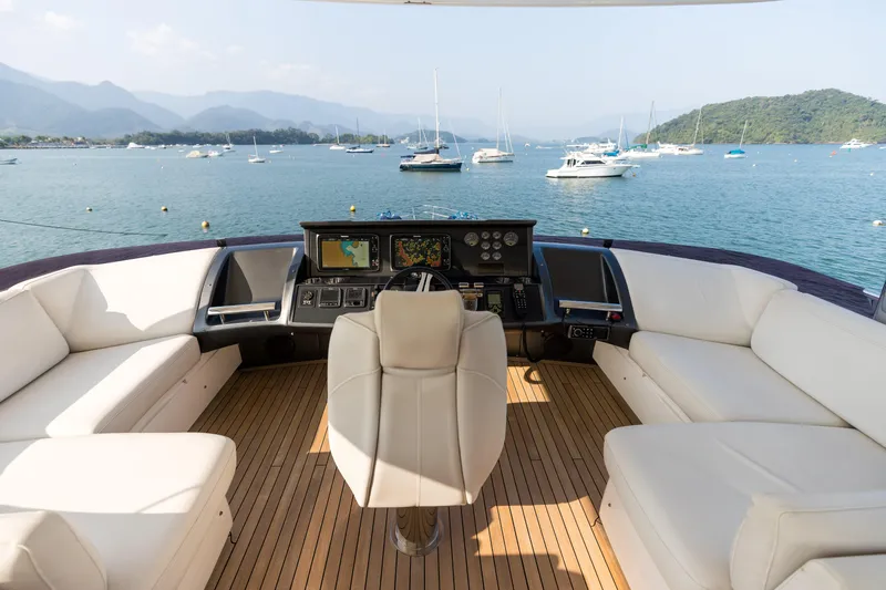 Far Niente Yacht Photos Pics Luxurious 2014 Princess Flybridge 82 Motor Yacht helm with scenic ocean view.