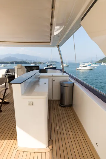 Far Niente Yacht Photos Pics Luxurious 2014 Princess Flybridge 82 Motor Yacht deck with scenic ocean view.