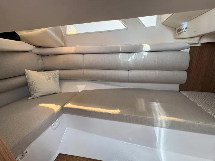 Love You More Yacht Photos Pics Interior of 2019 Four Winns H350 boat with beige seating and cushion.