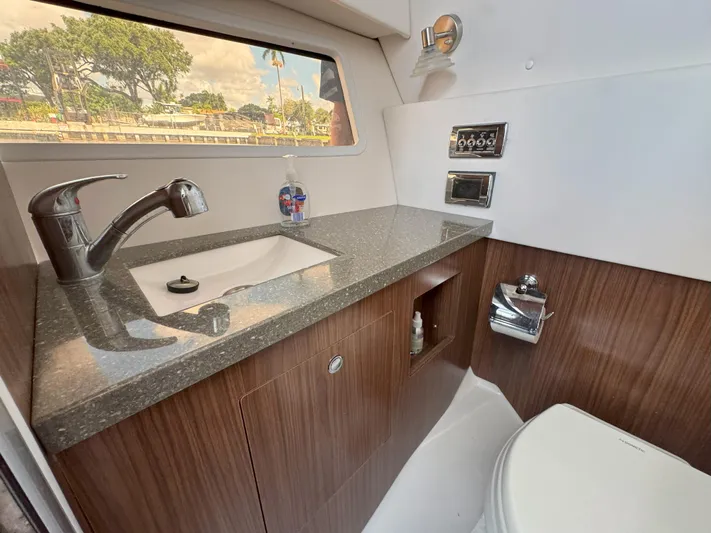 Love You More Yacht Photos Pics Luxurious 2019 Four Winns 350H boat bathroom with modern sink and toilet.